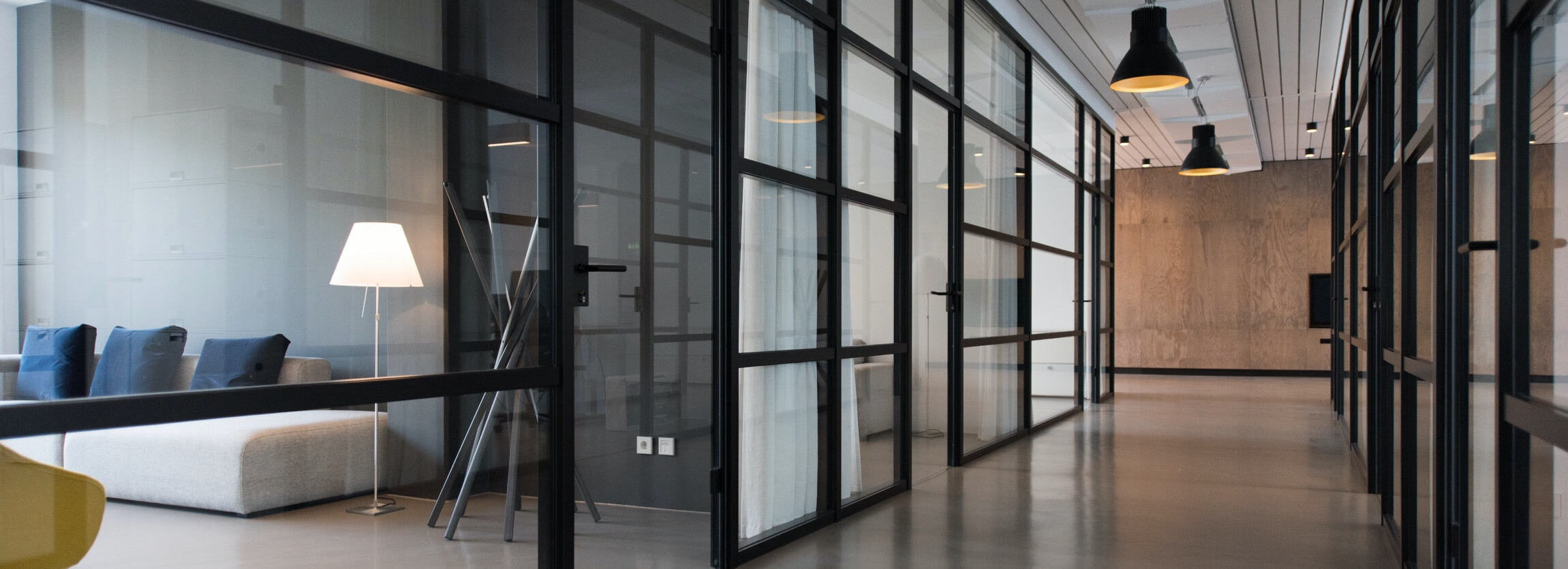 hallway with glass doors in an office