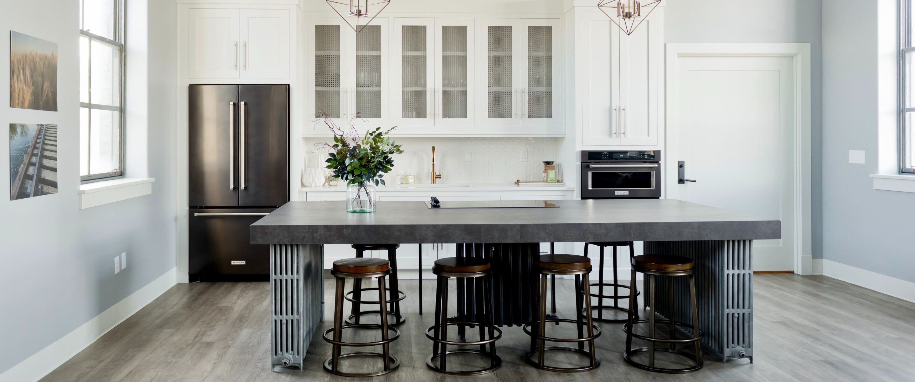 view of kitchen in an apartment with seating around a table